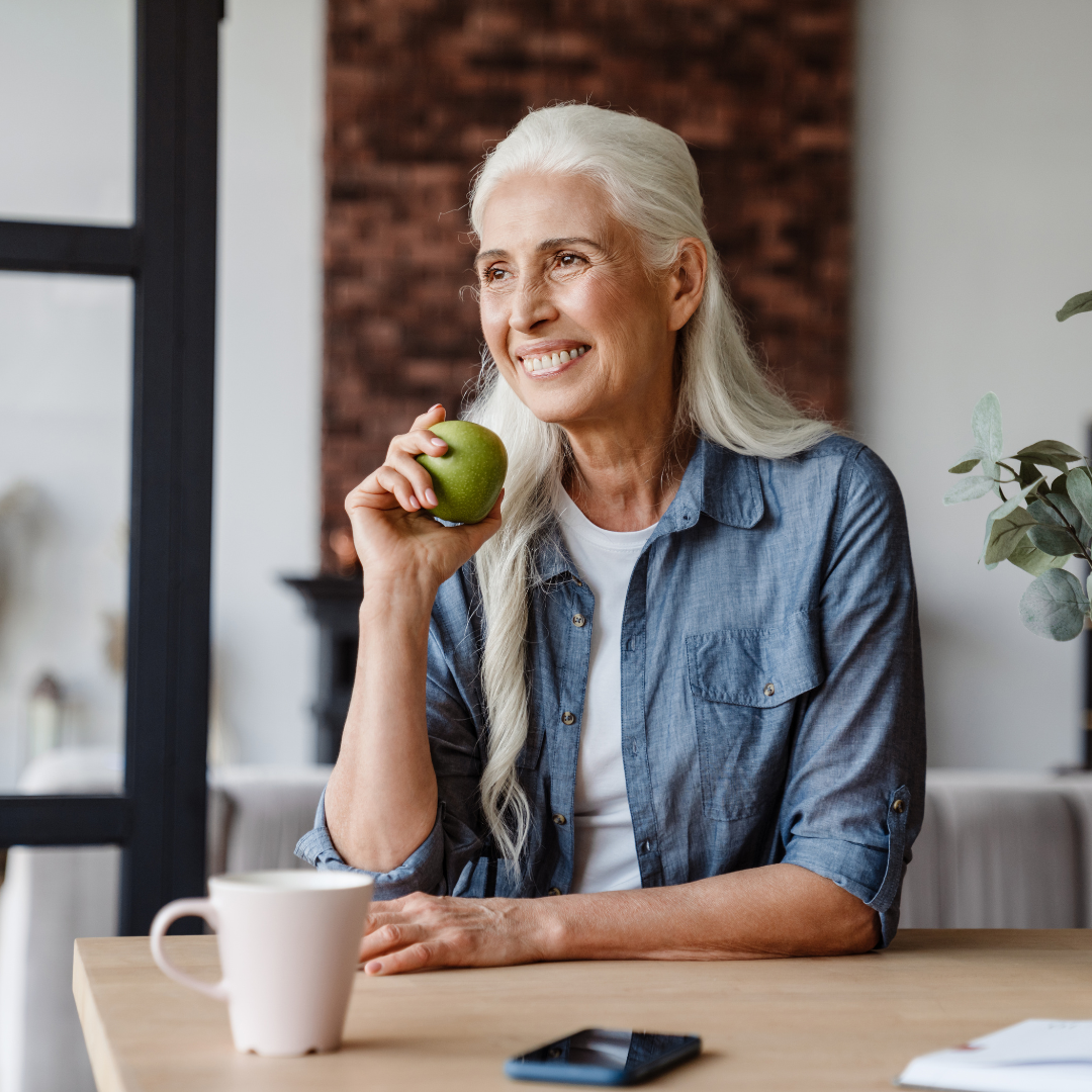 Elderly Woman Eating Apple