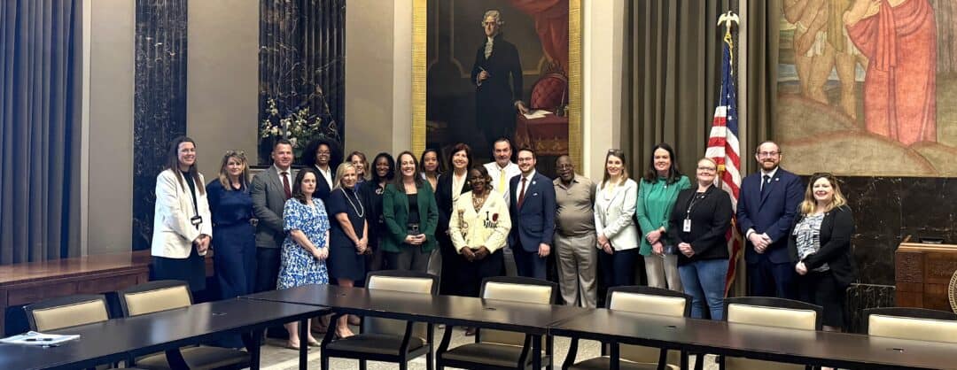 Group photo of leaders and legislators at Louisiana child welfare roundtable.