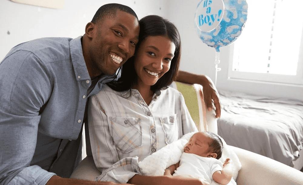 father, mother and infant in hospital
